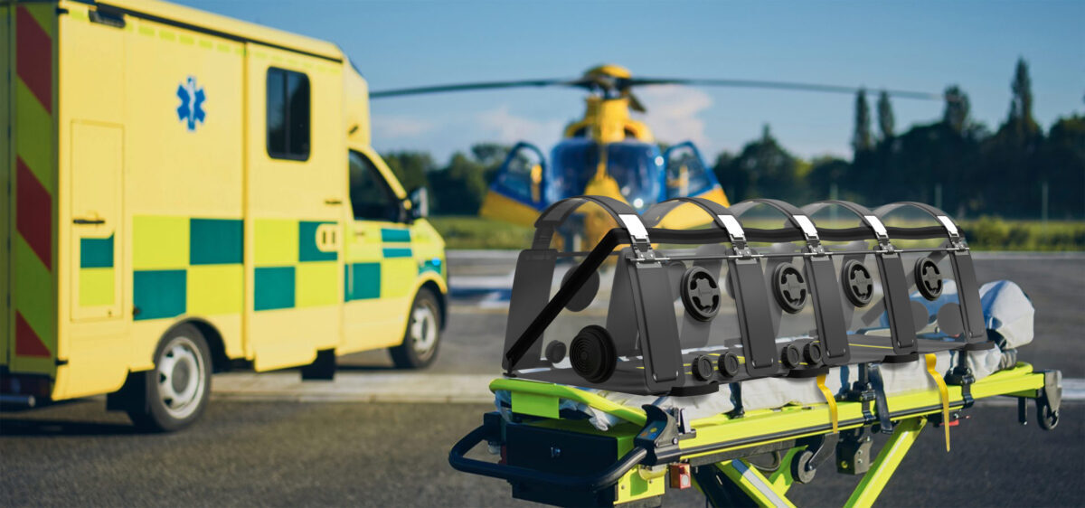 Stretcher with the Aeropod 15 next to ambulance and helicopter.