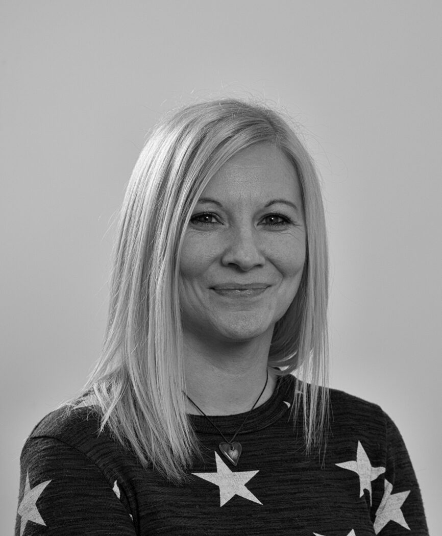 black and white portrait Caroline Wilson, wearing a starry top.