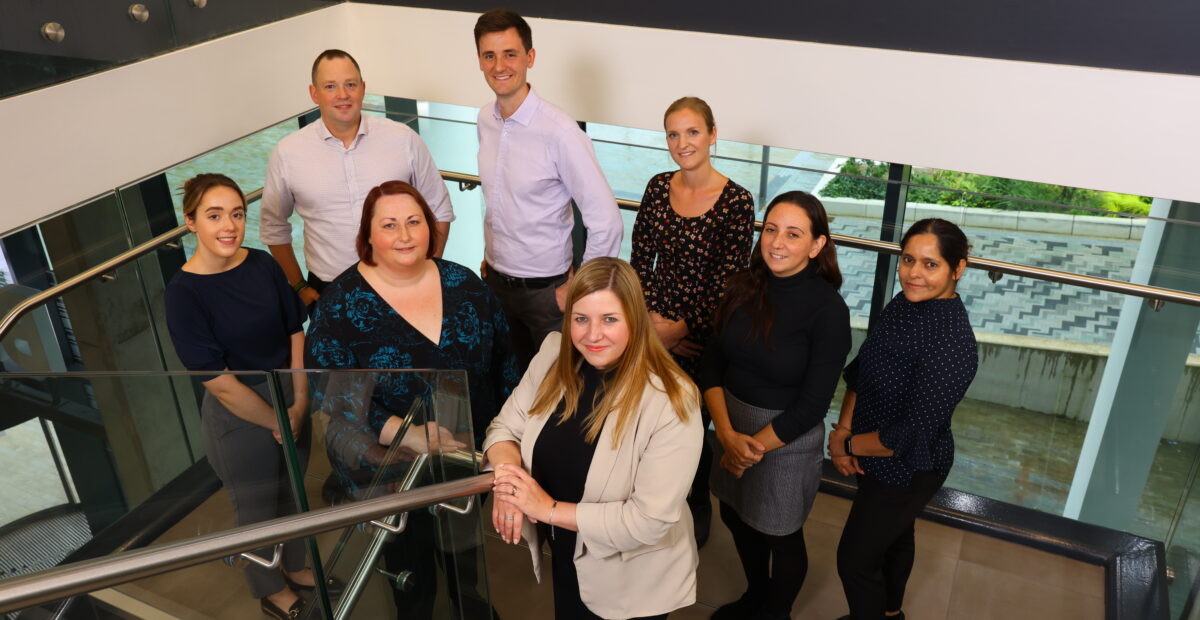 The team at Novopath standing in the stairwell at The Biosphere