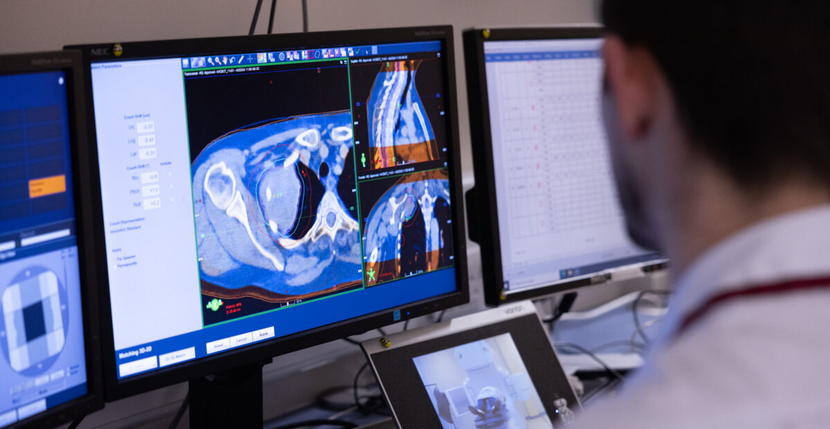 Doctor analysing a scan image on a computer screen.