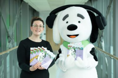 The image shows Bobby the mascot with his book