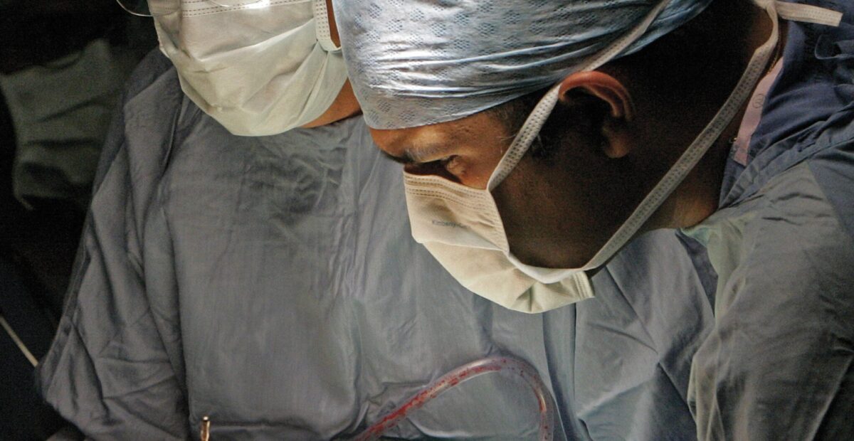 Image shows two surgeons operating
